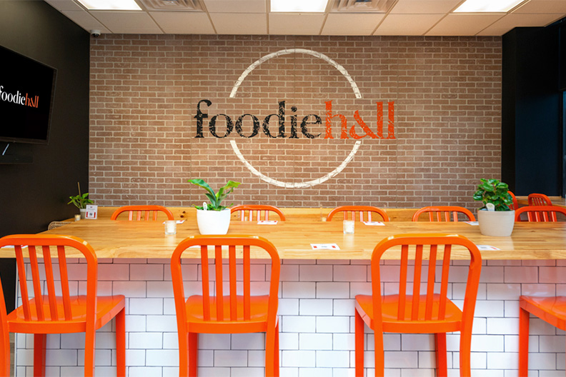 Seating area with tables and chairs at our food court near West Berlin, New Jersey.