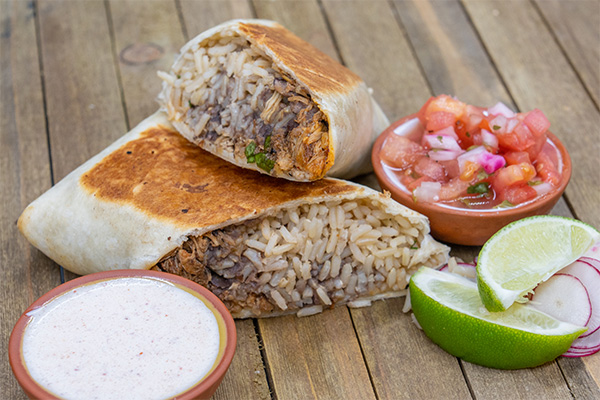 Cut open Chicken Burrito with Pico de Gallo from our Voorhees multi-concept restaurants.