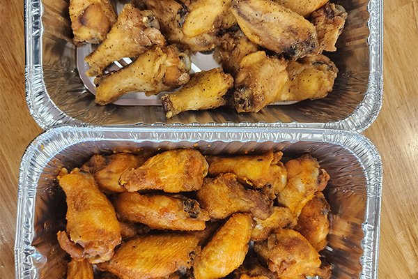 Two trays of Chicken Wings prepared for Golden Triangle, Cherry Hill catering.